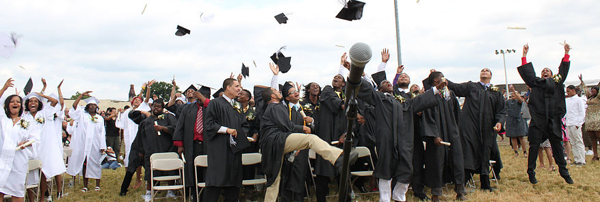Groups of Students throwing graduation caps into the air